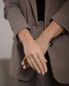 a woman's hand with the word love tattooed on it