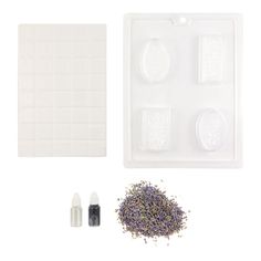 an assortment of items for making soap on a white background