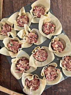 some food that is sitting on top of a pan and ready to be cooked in the oven