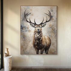 a painting of a deer with large antlers on it's head is displayed in an empty room