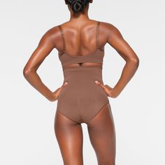 Shape your curves and feel supported in this stretchy shapewear high waisted brief with strong targeted compression at the tummy and waist, butt-shaping pockets, and a silicone interior underband that keeps it from rolling down. Hits right below the bust and features a wider crotch for added coverage and a cotton gusset. Fits true to size. | SKIMS High-Waisted Brief | Medium Neutral | Seamless Sculpt Solid Shapewear With Built-in Bra, Compressive Shapewear Brief With Built-in Bra, Full Coverage Shaping Shapewear For Workout, Shapewear With Medium Bust Support For Workout, Workout Shapewear With Medium Bust Support, Solid Shapewear With Built-in Bra And Shaping Fit, High Stretch Underbust Shapewear With Built-in Bra, Seamless High Stretch Shapewear, Compressive Shapewear Bottoms With Built-in Bra