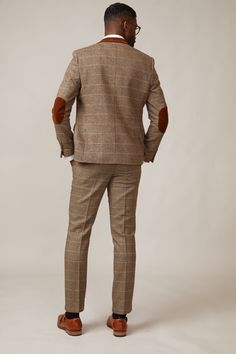 Inspired by old age country wear, the DX7 suit remains an ever so popular style, reminiscent of the 18th century. It is ideal for Autumn/Winter with its earthy colour palette and heavy fabric. A touch of modernism is added with a velvet contrast collar, elbow pads and pocket trims, nudging it back into the 21st century. Perfect for a rustic countryside wedding. Mix-and-match the waistcoat to differentiate from the groomsmen and match your accessories with the bridesmaid dresses. Looking for a pl Fitted Brown Suit, Tailored Wool Suits For Fall, Brown Single-breasted Suits For Fall, Brown Tweed Jacket For Tailoring, Brown Tweed Jacket With Suit Collar, Tailored Brown Tweed Jacket With Notch Lapel, Fall Tweed Jacket With Suit Collar, Tailored Brown Single-breasted Tweed Jacket, Fitted Wool Suits For Fall