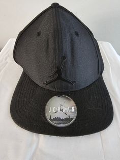 From Nike and Air Jordan this is a cool Jumpman baseball cap featuring the triple black style.  No tags but never used, sticker still on brim and brim is still solid. Shipping is FREE!! If you get a chance please check out my Etsy store where there is, dare I say....something for everyone :) Contact me if you want to purchase multiple items of mine, I give discounts for bundles! Black Jordan Hat, Black Throwback Snapback Baseball Cap, Black Six-panel Snapback Hat For Baseball Season, Black Snapback Hip Hop Baseball Cap, Black Breathable Six-panel Snapback Hat, Air Jordan Nike, Triple Black, Black Hat, Say Something