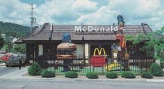 a mcdonald's restaurant in the middle of a parking lot