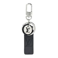 This is an authentic LOUIS VUITTON Reverse Monogram Eclipse Neo LV Club Bag Charm Key Holder. This chic small key holder features a polished silver clasp and key ring with the Louis Vuitton monogram in black leather. Small Key Holder, Handbag Wallet, Wallet Accessories, Key Holder, Authentic Louis Vuitton, Key Ring, Key Rings, Louis Vuitton Monogram, Dust Bag