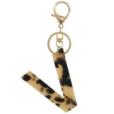 the letter v is made out of tortoiseshell and has a keychain