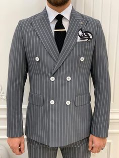 Impeccably tailored, our pinstripe double-breasted anthracite suit is a statement piece that will make you look dapper at any event. From the HolloMen fall-winter '22 collection. Suit Color: Anthracite The suit's fabric includes 65% Polyester, 32% Viscone, and 3% Lycra. Its jacket has a double-breasted collar, double slits, and flap pockets, and it is fully canvassed. Suit Care Instructions: Dry clean only In your package, we will include a jacket, pants, shirt, tie, and pocket square. Our model Winter Slim Fit Three-piece Suit With Long Sleeves, Slim Fit Long Sleeve Three-piece Suit For Winter, Winter Long Sleeve Slim Fit Three-piece Suit, Slim Fit Long Sleeve Three-piece Winter Suit, Fitted Three-piece Suit For Business Casual With Long Sleeve, Slim Fit Single Breasted Three-piece Suit With Long Sleeves, Slim Fit Single Breasted Three-piece Suit, Fitted Double Breasted Suit With Long Sleeves For Office, Fitted Double Breasted Long Sleeve Suit For Office