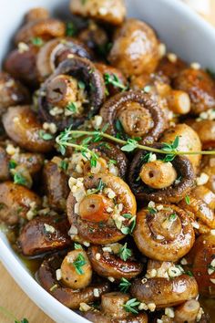 the dish is full of mushrooms and garnished with parsley