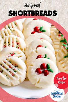 a plate full of christmas shortbreads with holly decorations on them and the words, whipped shortbreads save this recipe