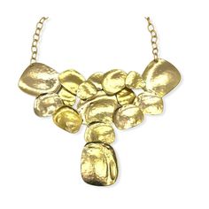 Vintage brutalist style bib necklace by designer Kenneth J Lane. Statement necklace features large interconnecting flat discs of hammered gold plated metal. It has a plated open link chain with large hook closure. The necklace is deadstock and had its original hangtag and price of $150. Unworn condition. Note that the necklace was hand crafted and does show slight variation in color, bubbles and marks in the plating. This is consistent with the piece and should not be considered flaws. Please se Gold-tone Hammered Metal Necklace, Hammered Gold Metal Necklaces, Gold Hammered Metal Necklaces, Gold Hammered Metal Necklace, Modern Hammered Metal Necklace, Gold Metal Bib Necklace, Gold Metal Bib Necklace With Adjustable Chain, Purple Party, Bib Necklaces