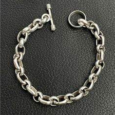 For Sale Is A Stunning .925 Sterling Silver Unisex Circle And Oval Rolo Link Bracelet. This Solid Piece Is Directly From My Personal Collection! This Bracelet Measures 7-1/2” Long And 7mm Wide. The Bracelet Weighs A Very Substantial 25 Grams Or Almost 1 Full Ounce Of Silver. This Piece Is Stamped 925 For Sterling Silver. Classic Sterling Silver Hallmarked Oval Link Bracelet, Classic Hallmarked Sterling Silver Oval Link Bracelet, Classic Sterling Silver Bracelet With Silver Chain, Classic Sterling Silver Bracelet With Oval Link, Classic Sterling Silver Oval Link Chain Bracelet, Classic Sterling Silver Oval Link Bracelet, Classic Hallmarked Oval Link Chain Bracelet, Timeless Sterling Silver Bracelet With Oval Link, Timeless Sterling Silver Oval Link Bracelet