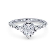 a white gold engagement ring with an oval diamond center stone and pave set shoulders