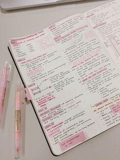 an open notebook sitting on top of a desk