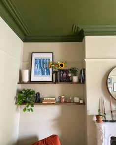 a living room filled with furniture next to a fire place under a green painted ceiling