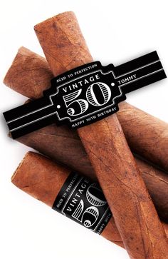 five cigars stacked on top of each other with the label stating vintage 50 years