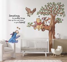 winnie the pooh wall decal in a child's room with white furniture