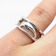 Good vintage condition. 925 Sterling Silver Vintage Friendly Dolphin Open Band Ring Size 6 Weight: 4.5g WELCOME TO PAWN SHOP We are an actual pawn shop and have been in business for over 25 years. Since 1990, our establishment has been serving a variety of clients by providing them with short term cash solutions and options of liquidity regarding their treasured heirlooms. Acknowledging that today′s customers are very sophisticated and are looking for a variety of investments, our acquisitions a Pawn Shop, Hand Picked, 25 Years, Band Ring, Dolphins, Band Rings, Patina, Vintage Jewelry, Jewelry Rings