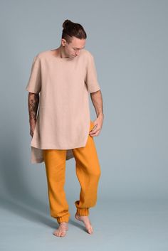 "🌿 ITEM DESCRIPTION Men's linen pants TEO made from soft washed linen. Tapered leg with elastic cuffs. Regular fit. These pants in TURMERIC color of flax linen, but can be made in any color from our wide color palette. The pants have side pockets and a wide comfy elastic waist. Fabric: 100% natural linen in a medium weight, Oeko-Tex certified All SHĀNTIMA linen items come in a beautiful wrap, which makes them not only a lovely purchase but also a cool gift. 🌿 SIZING Petit, Regular, Plus Size - Mens Linen Clothing, Linen Clothes For Men, Linen Trousers For Men, Natural Linen Pants, Mens Linen Outfits, Mens Tunic, Linen Tunic Shirt, Linen Outfits, Yoga Pants Men