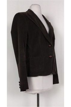 Made with classic corduroy, this jacket is a cool weather must-have. Its deep brown color will pair great with neutral basics. Size 6 97% cotton, 3% elastane Double button closure on front Padded shoulders 3 front pockets Double vents on back 3 buttons on sleeves Unlined Bust 37" Waist 31" Shoulder to hem 23" Brown Cotton Blazer For Work, Brown Cotton Workwear Blazer, Elegant Brown Cotton Outerwear, Brown Cotton Blazer For Fall, Brown Single-breasted Cotton Blazer, Brown Cotton Blazer With Buttons, Brown Corduroy Blazer For Work, Winter Brown Corduroy Blazer, Brown Corduroy Blazer With Button Closure