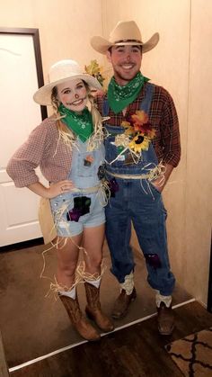 a man and woman dressed up in cowboy outfits, standing next to each other on the floor