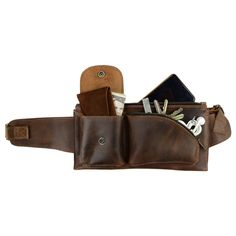 a brown leather belt with cell phones and wallets in the pocket on white background