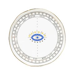 a white and gold plate with an evil eye on the center, surrounded by stars