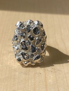 "Outstanding quality. Very detailed. Cubic Zirconia Stones, 3-4mm/.1-.25Ct diamond weight each  Solid Sterling Silver Ring! Not just silver plated. stamped 925. Dimensions: 1.25 X 1.1\" (30x24mm) Comes in a Cotton Lined Jewelry Box approximate weight 30.gm Available in sizes: 6-14 100% satisfaction Guaranteed. Returns accepted within 30 days. If you are unhappy with your purchase for any reason, please don't rush to give negative feedback, simply place the item back in its original box and send Silver Diamond Dome Ring With Polished Finish, Silver Open Ring With Polished Finish, Silver Nugget Jewelry For Anniversary, Classic Silver Jewelry With Stones, Silver Open Diamond Ring With Polished Finish, Silver Diamond Ring With Polished Open Ring Design, Silver Dome Ring With Polished Finish For Promise, Silver Dome Promise Ring With Polished Finish, Elegant Silver Cluster Ring With Stone Setting