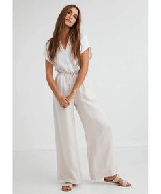 Breezy and contemporary, these ultra-laidback high-rise pants are designed in a slouchy wide-leg style with a drawstring waist for an adjustable shape. Made In Los Angeles 100% Linen Machine wash cold Ruffle drawstring waist Side pockets Model is 5'10" and wearing a size small Waist: 25" Waist to hem: 42" Inseam: 31" (size small) Sand Stone, High Rise Pants, Wide Leg Pant, Small Waist, Drawstring Waist, Wide Leg Pants, Wide Leg, High Rise, Angeles