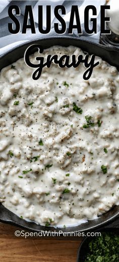 sausage gravy in a cast iron skillet with parsley on the side