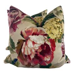 a large flowered pillow on top of a white background with pink, yellow and red flowers