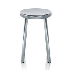 a stool that is sitting on top of a white surface with chrome legs and a round seat