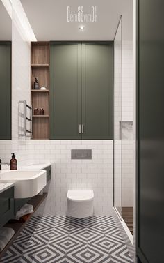 a bathroom with green cabinets and a white toilet