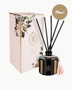 an image of a bottle of reed diffuser next to it's packaging box