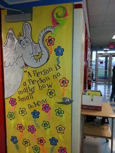 a classroom door decorated with an elephant and flowers