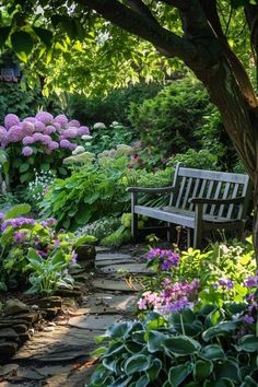 a wooden bench sitting in the middle of a garden filled with lots of flowers and greenery