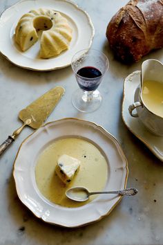 a table topped with plates and bowls filled with food