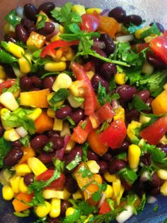 a salad with black beans, corn and tomatoes