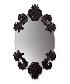 an ornate mirror with red paint on the bottom and sides, is shown in front of a white background