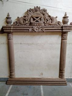 an antique fireplace surround made out of stone