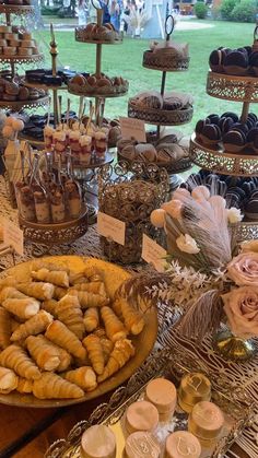 an assortment of pastries and desserts on display at a wedding or bridal party