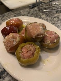 stuffed peppers with ham and olives on a plate