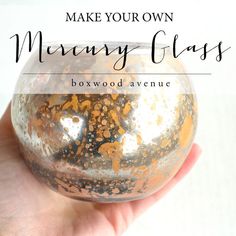 a hand holding a glass ball with gold flecks on it and text that reads make your own marvy glass bowwood avenue