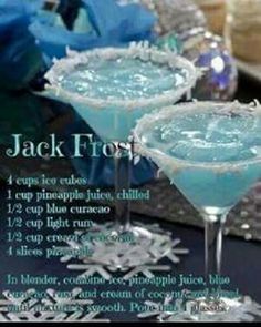 an image of two blue cocktails on a table