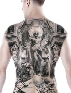 the back of a man's shirt with an angel and lion tattoo on it