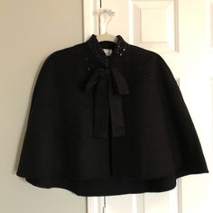 New With Tags, 55% Wool, 35% Polyester, 10% Rayon. Perfect For Wearing Over Winter Formal Or Semi Formal Dresses Or Light Sweaters! Wool Cape For Formal Occasions, Formal Wool Cape Outerwear, Chic Black Wool Cape, Evening Spring Cape Outerwear, Chic Evening Cape Outerwear, Spring Evening Cape Outerwear, Elegant Cape For Fall Party, Elegant Fall Cape For Party, Formal Fitted Long Sleeve Cape