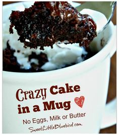 there is a spoon in a cup with ice cream and crazy cake on it