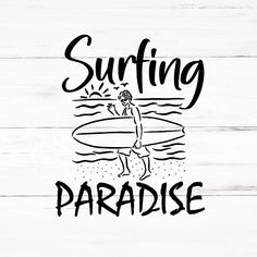 the words surfing paradise are in black ink on white wood planks, with an image of a man carrying a surfboard