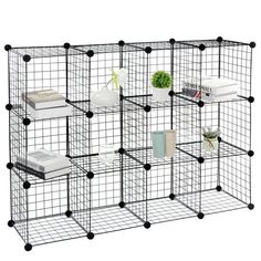 a black wire shelf with several shelves on each side and various items in the middle