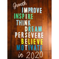 a sign that reads growth improve inspire think dream believe motivate in 2020