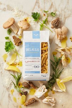 an image of pasta with mushrooms and herbs on the counter top in front of it